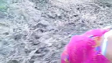 A desi husband fucks his wife outdoors in a bushes