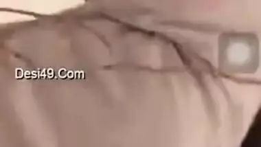 Girl performs XXX show and pulls up white T-shirt to expose boobs