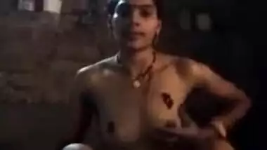 Young Desi woman sets the camera against her and starts washing XXX body