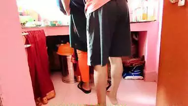 Newly married couple having quick honeymoon sex at resort kitchen