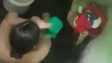 Female wears a yellow Indian sari after flashing her charms in voyeur porn video