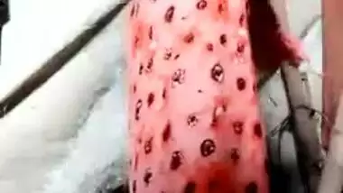 Beautiful Desi slut takes off red saree to reveal her slim XXX body