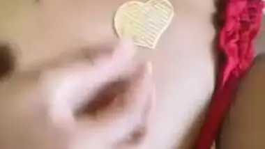 Desi chick in a red dress performs a sex show with XXX tits and vagina