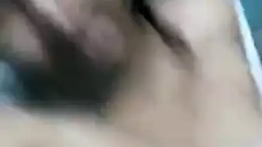 Slut takes her T-shirt down and remains with naked XXX Desi tits