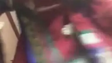 Desi female in a red sex sari flashes her XXX jugs changing the clothes