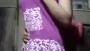 Village girl removing her kamiz